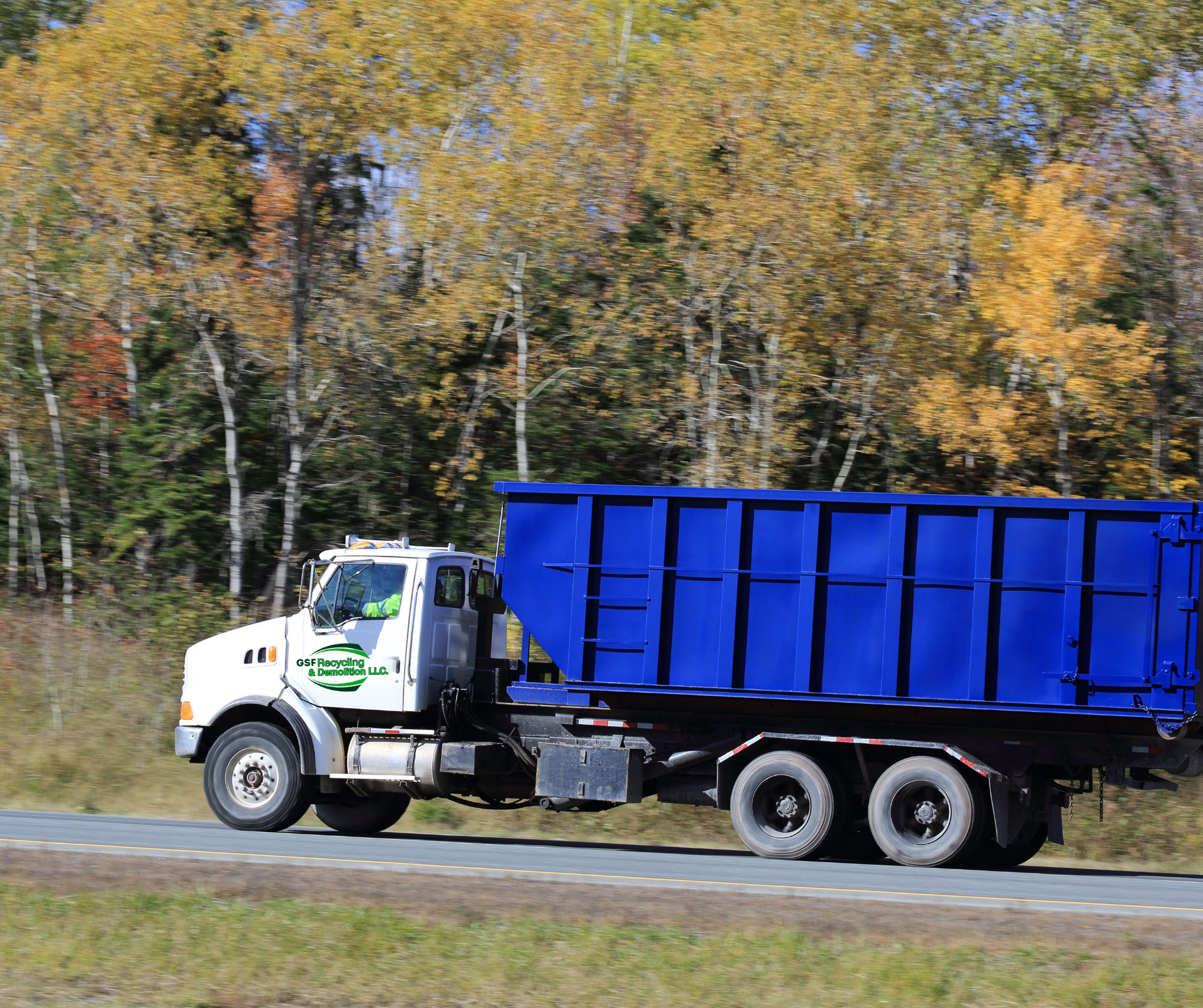 Roll-off dumpster loaded with construction debris